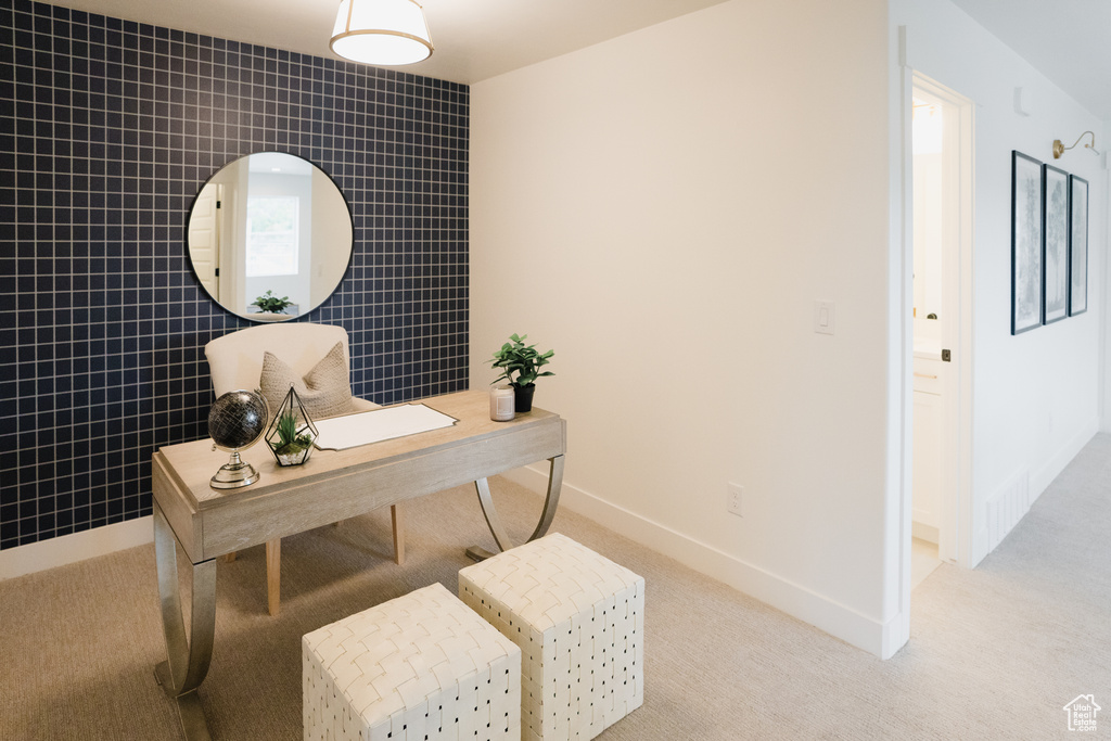 Office space with light carpet and tile walls