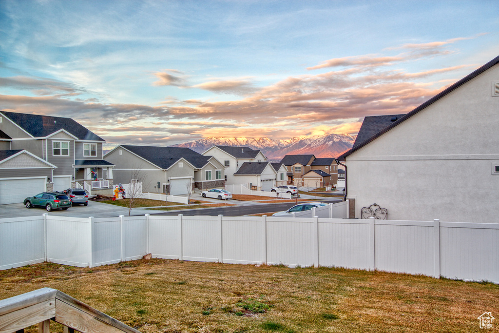 Yard at dusk with a garage