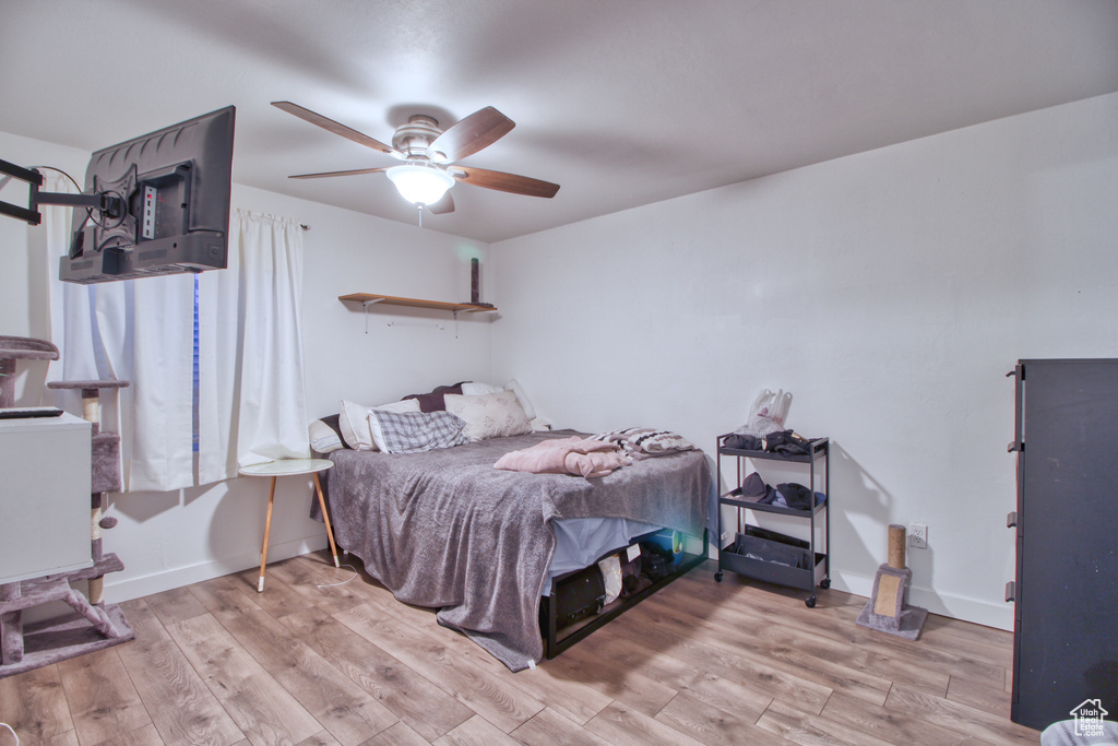 Bedroom featuring light hardwood / wood-style flooring and ceiling fan