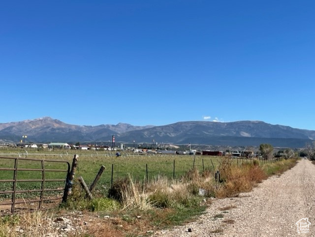 Property view of mountains with a rural view
