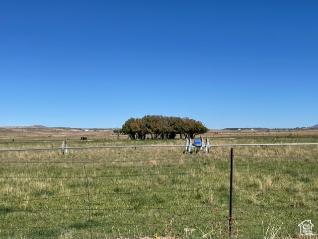 View of yard with a rural view