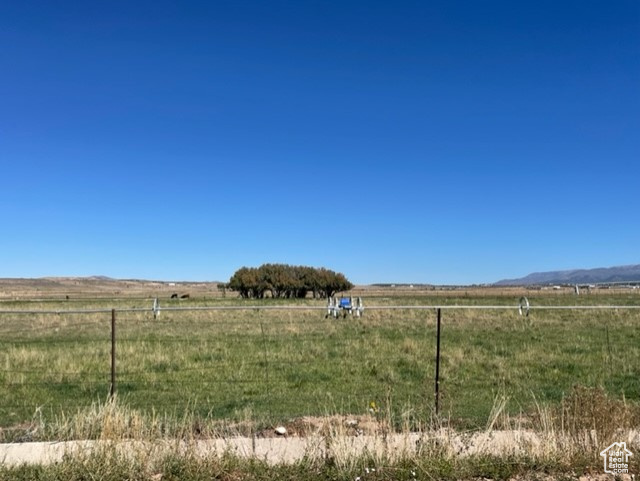 View of yard with a rural view