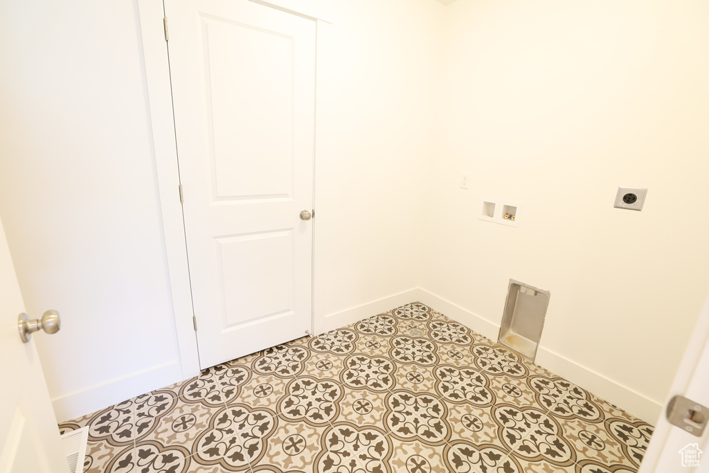 Clothes washing area with hookup for a washing machine and electric dryer hookup