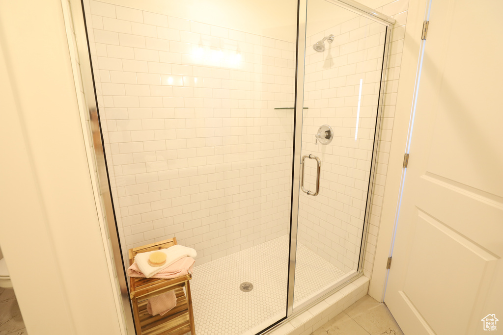 Bathroom with an enclosed shower and toilet