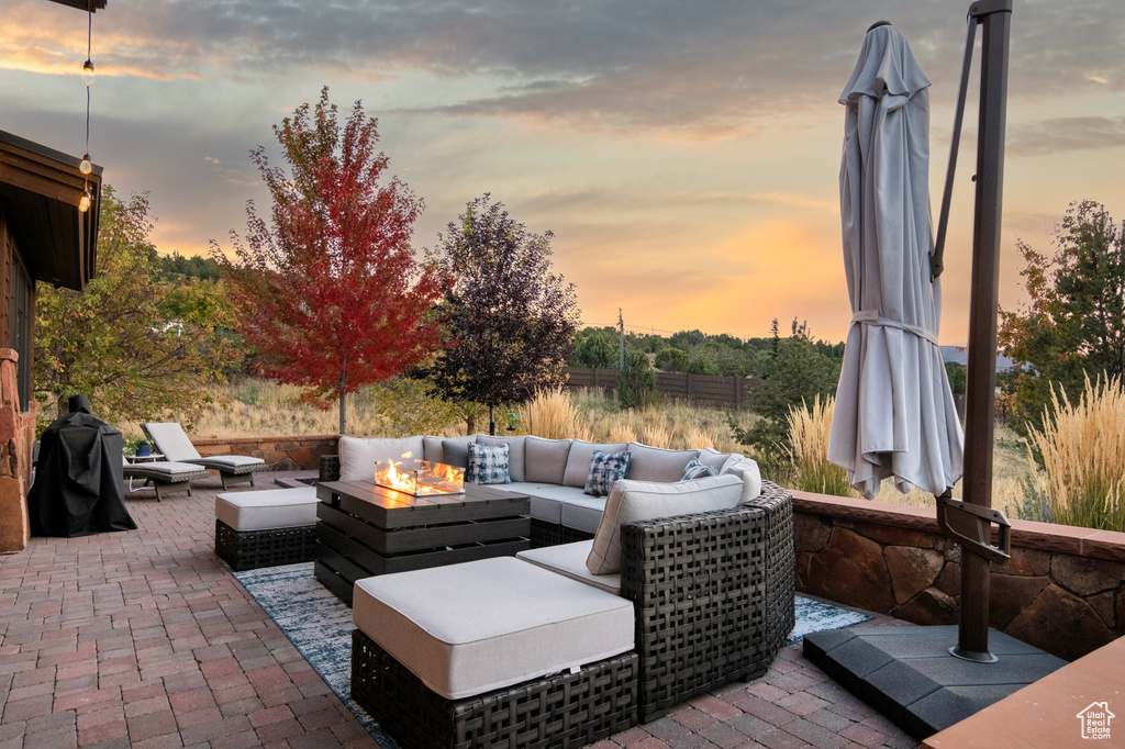 Patio terrace at dusk with outdoor lounge area