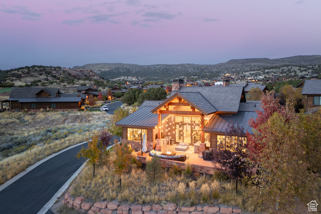 View of front of house with an outdoor hangout area and a mountain view