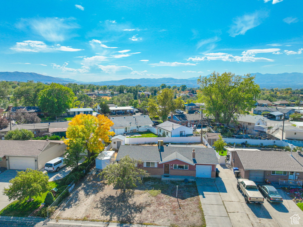 Birds eye view of property with a mountain view