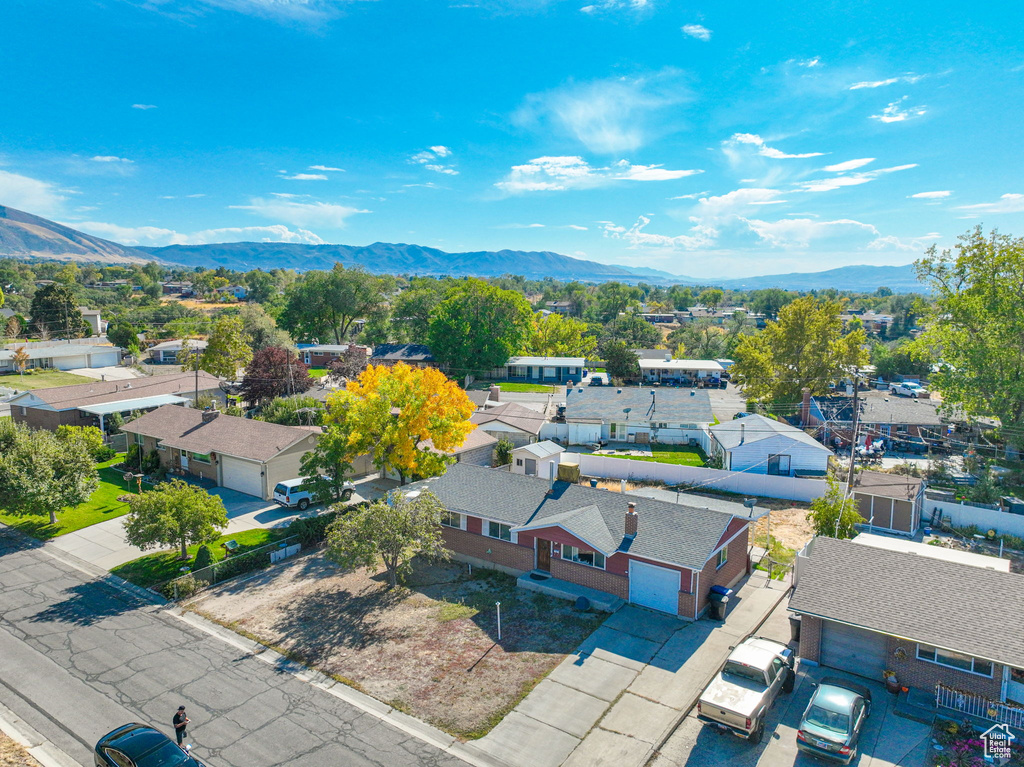 Birds eye view of property with a mountain view