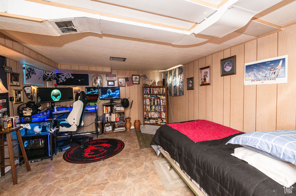 Bedroom with wood walls