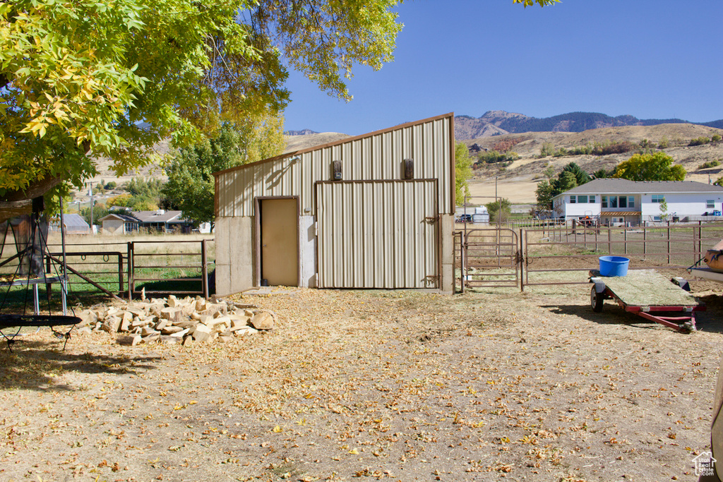 View of outbuilding with a mountain view