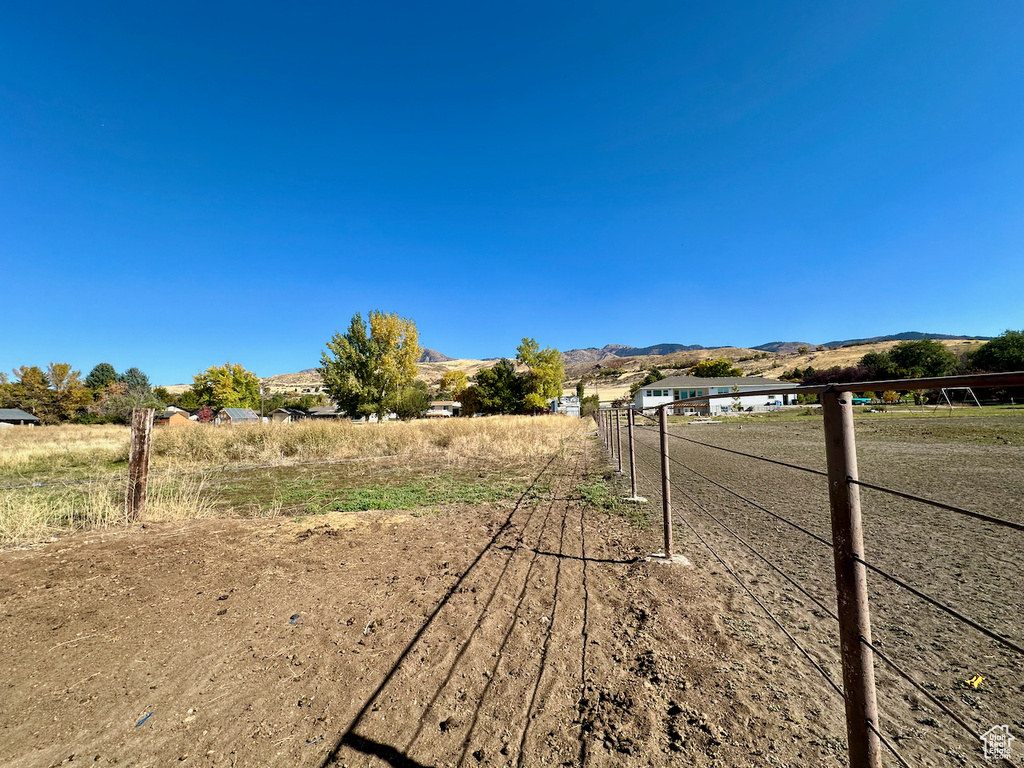 View of street with a mountain view and a rural view