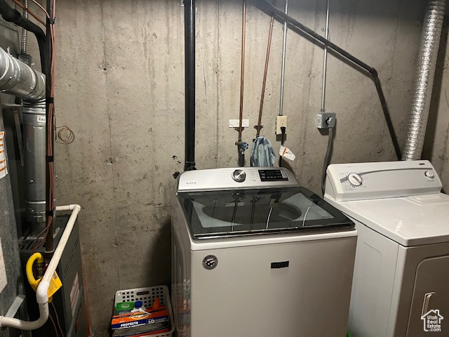 Laundry room featuring independent washer and dryer