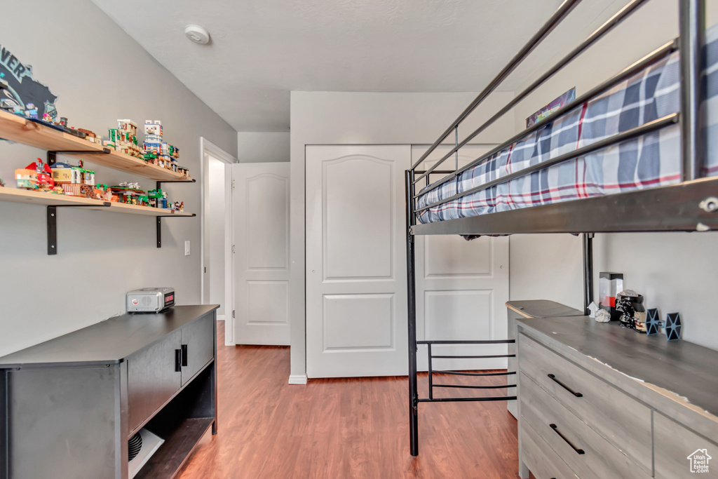 Bedroom with wood-type flooring