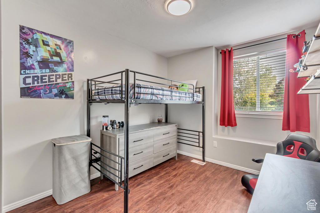 Bedroom featuring dark wood-type flooring