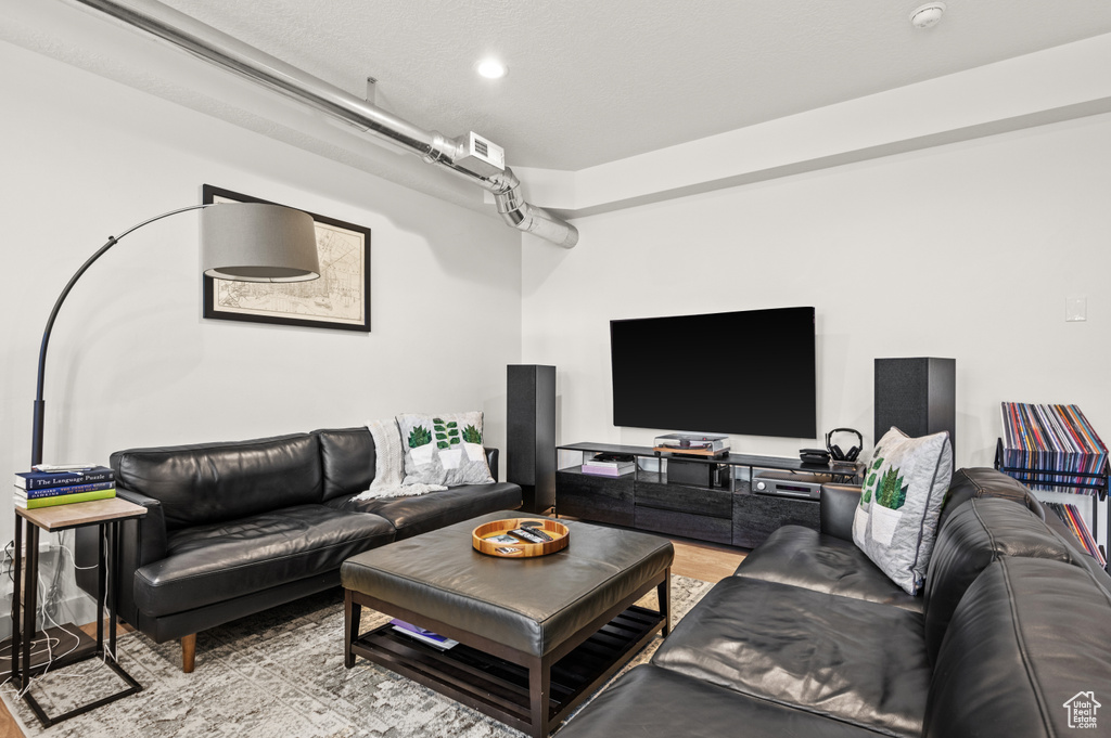 Living room with light hardwood / wood-style flooring