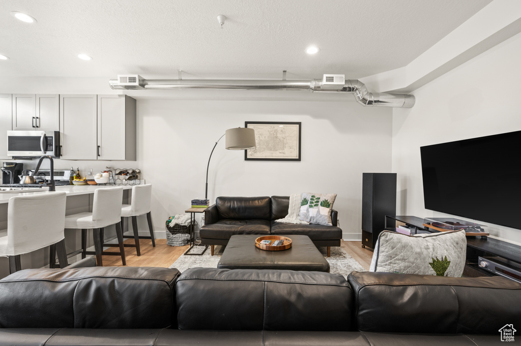 Living room with light wood-type flooring