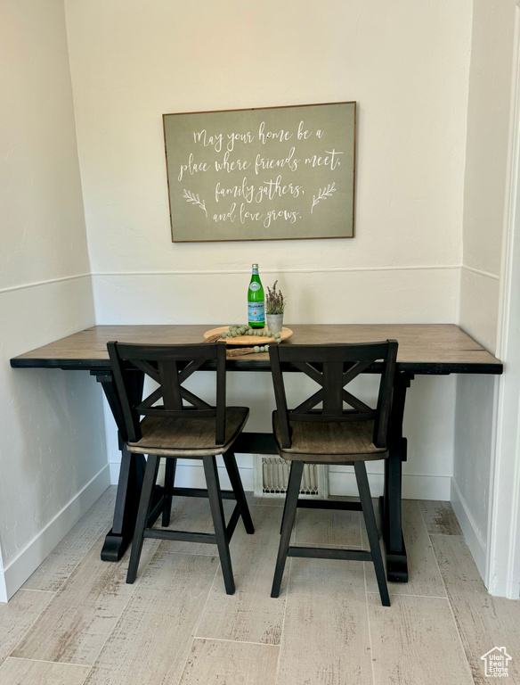 Dining room with light hardwood / wood-style flooring