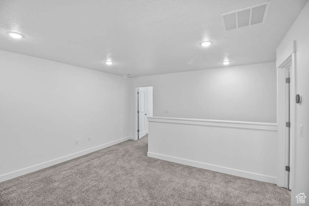 Spare room with light colored carpet