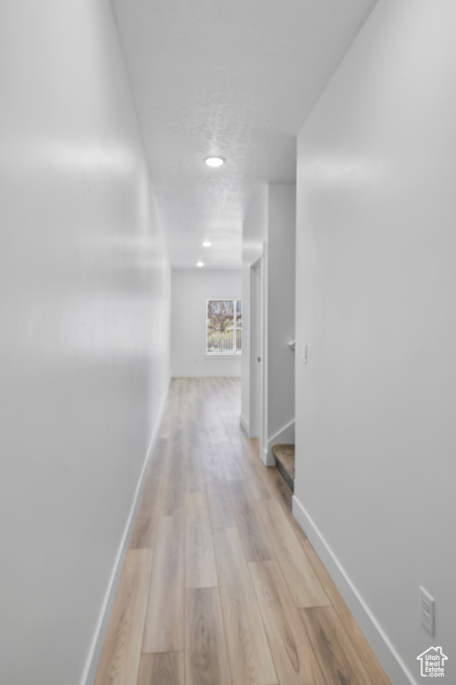 Hall featuring light wood-type flooring