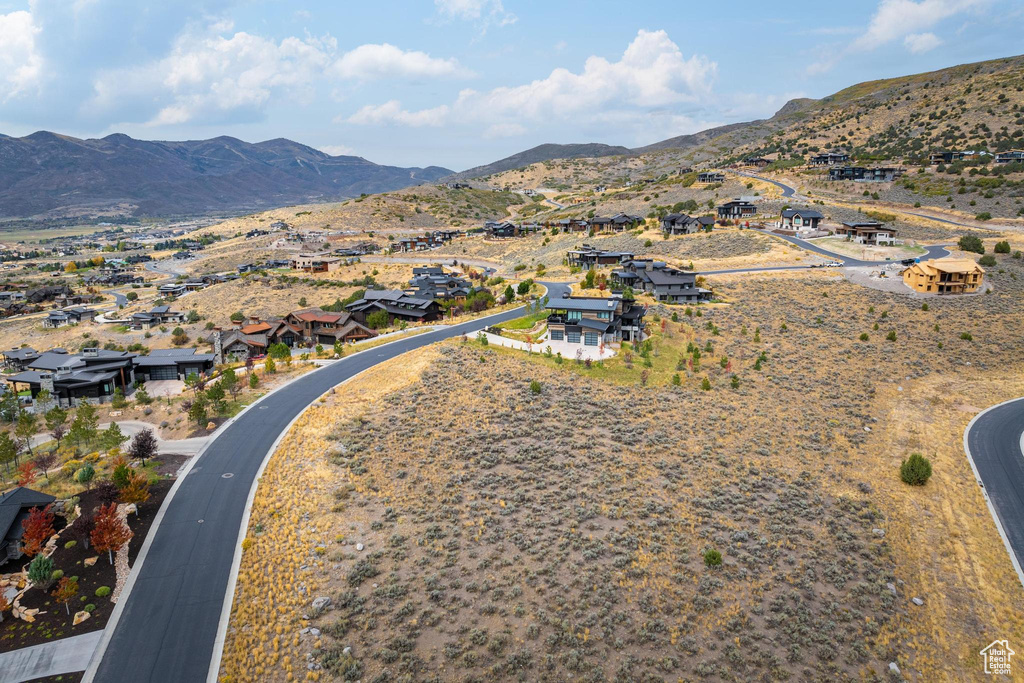 Birds eye view of property with a mountain view