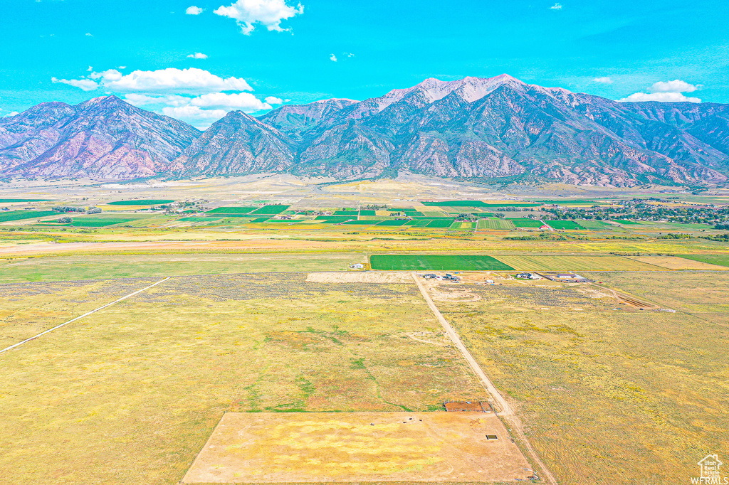 Property view of mountains with a rural view