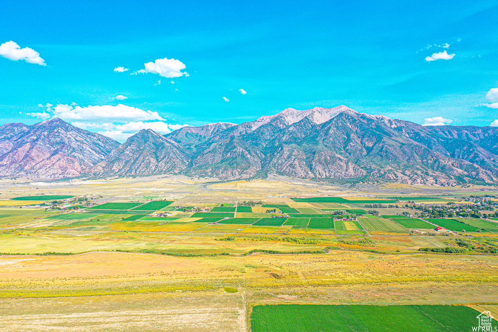 Property view of mountains with a rural view