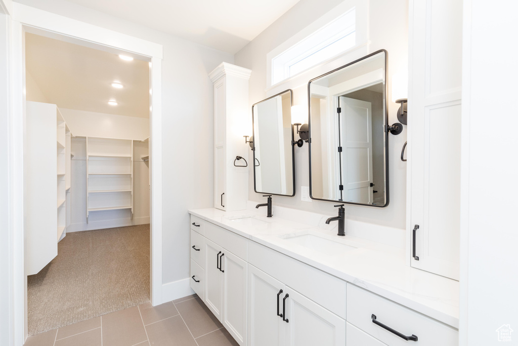 Bathroom featuring tile patterned floors and vanity