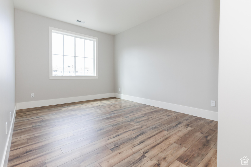 Spare room with light hardwood / wood-style floors