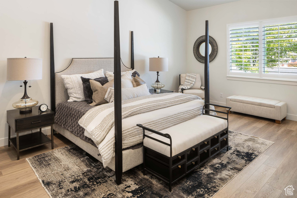 Bedroom with hardwood / wood-style floors