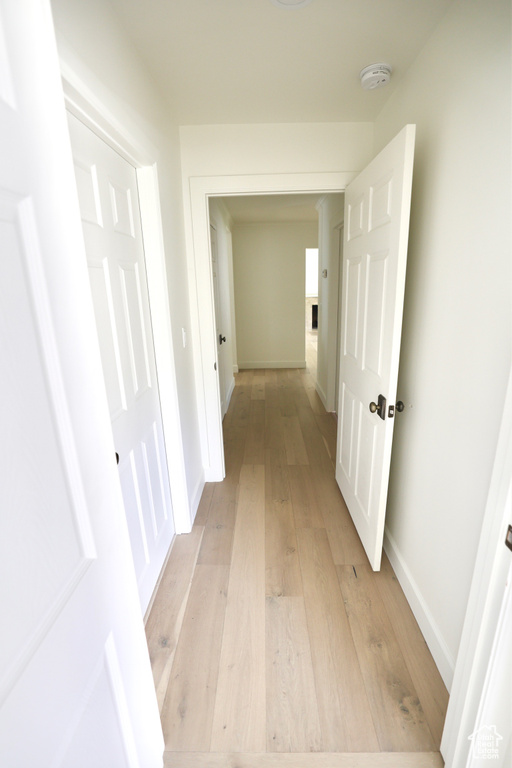 Corridor featuring light hardwood / wood-style flooring