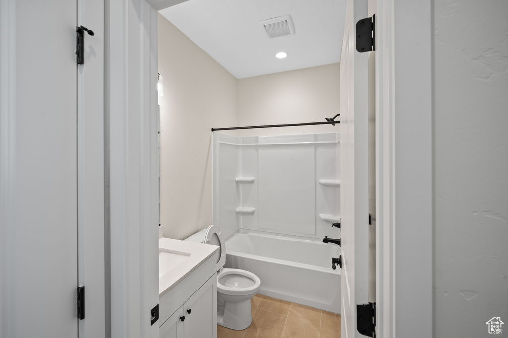 Full bathroom featuring shower / bathing tub combination, tile patterned floors, toilet, and vanity