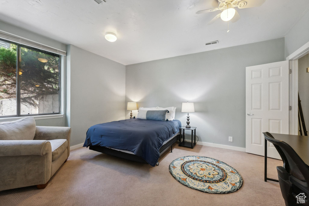 Bedroom featuring carpet floors and ceiling fan