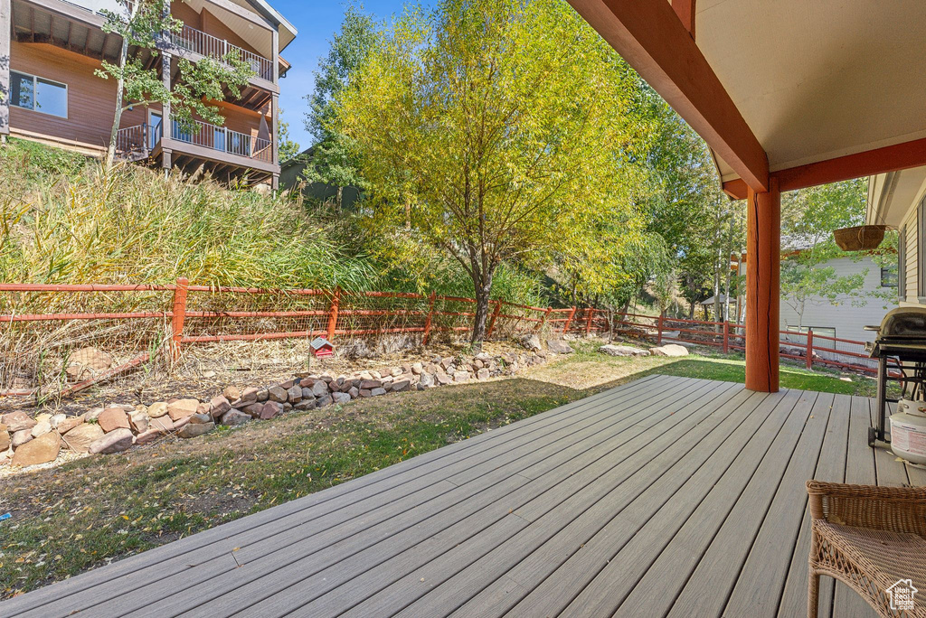 Wooden deck with a grill