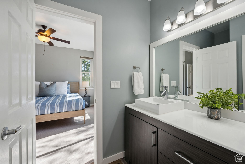 Bathroom with ceiling fan and vanity