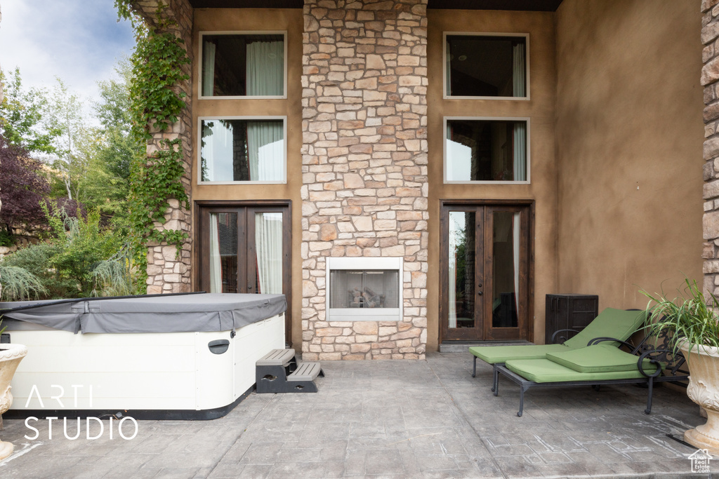 View of patio / terrace featuring a hot tub