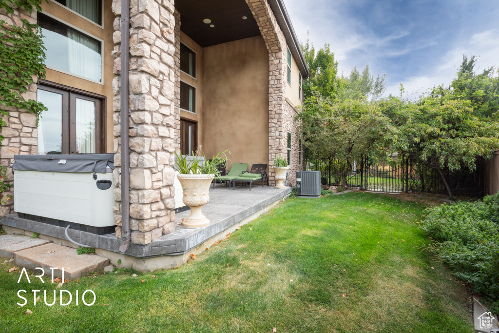 View of yard featuring a patio and central AC