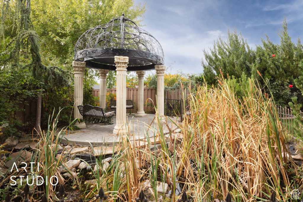 View of yard with a gazebo and a patio