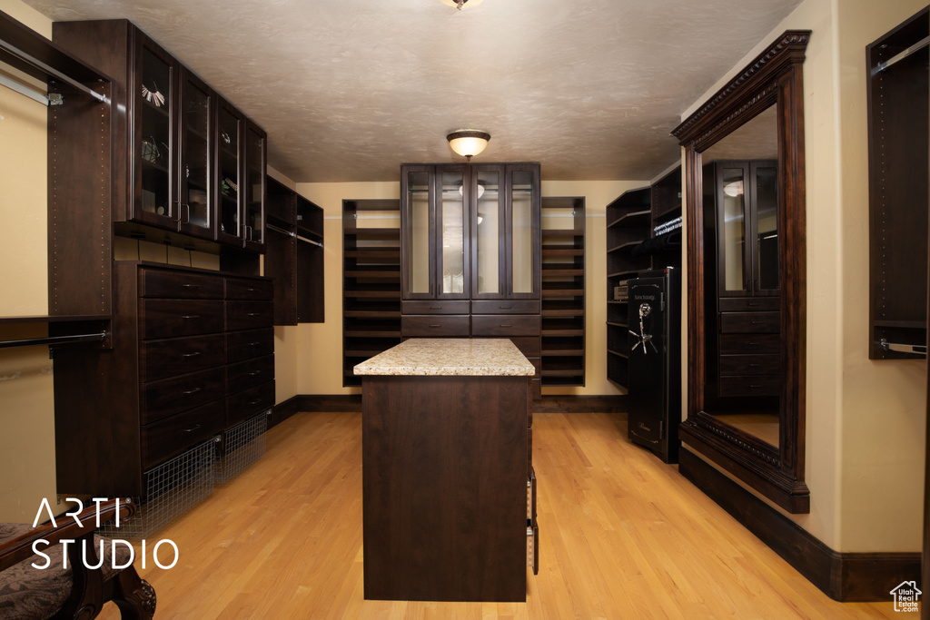 Spacious closet featuring light wood-type flooring
