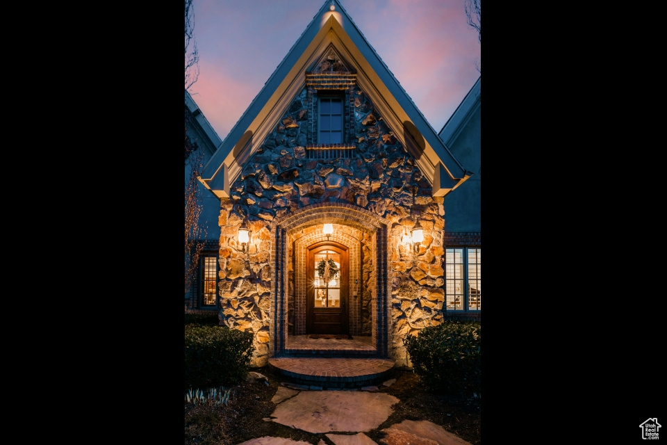 View of exterior entry at dusk