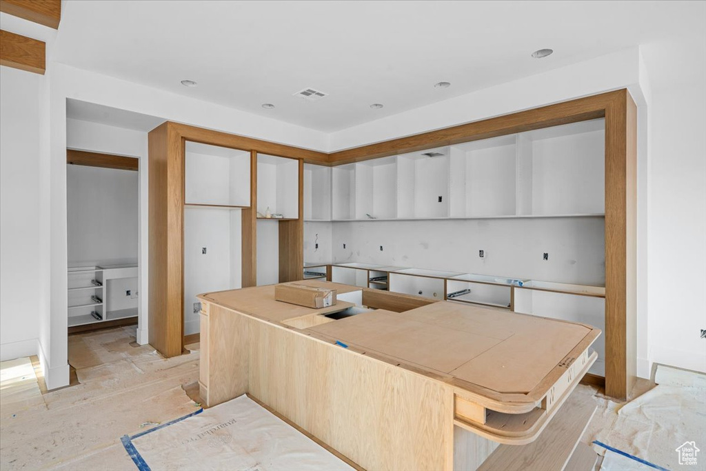 Kitchen featuring white cabinetry