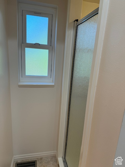 Bathroom featuring an enclosed shower