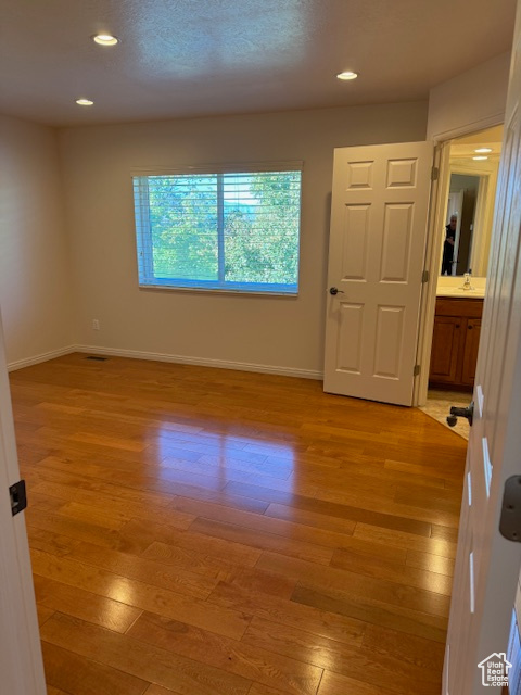 Unfurnished room with light wood-type flooring