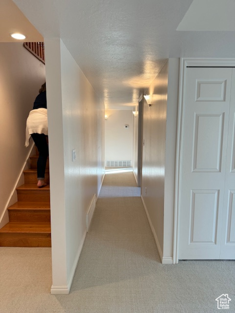 Hall featuring carpet