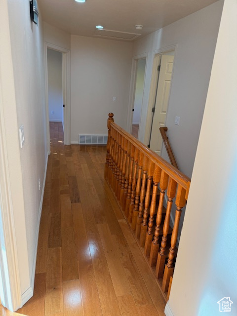 Hallway featuring wood-type flooring