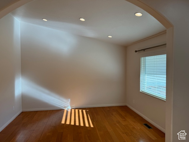 Unfurnished room featuring wood-type flooring