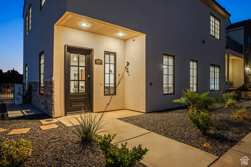 View of exterior entry at dusk