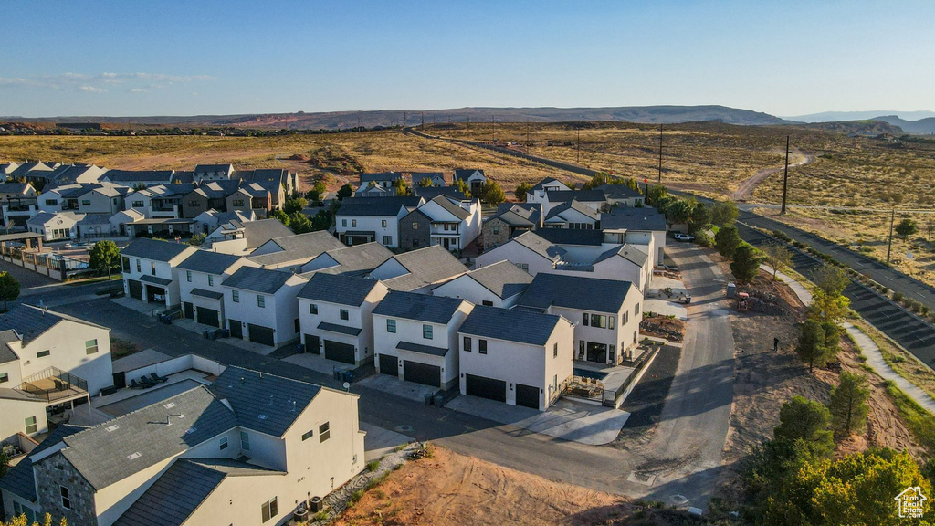 Birds eye view of property with a mountain view