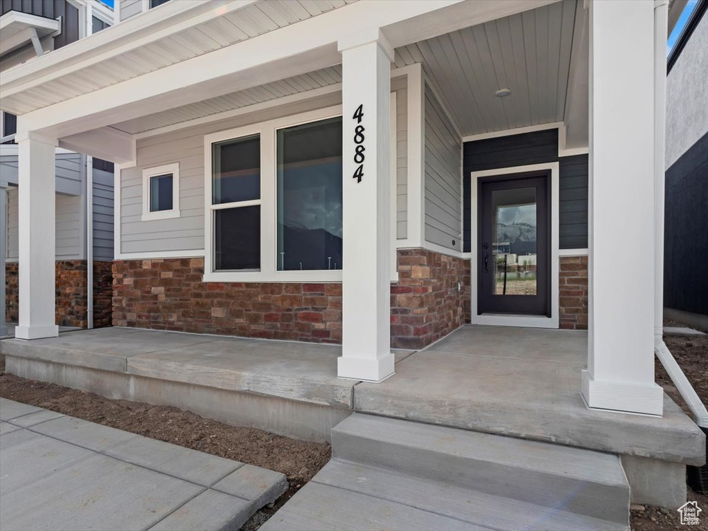 Property entrance featuring a porch