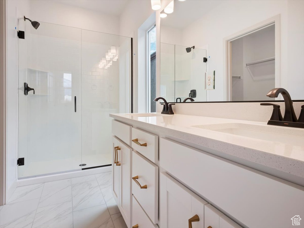 Bathroom with an enclosed shower and vanity