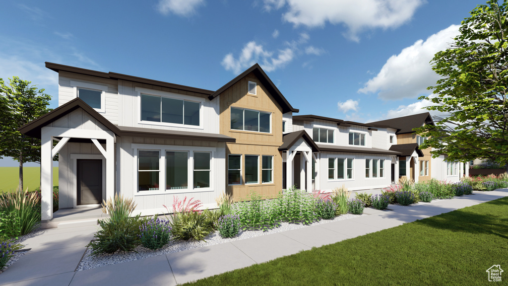 View of front facade with a garage and a front yard